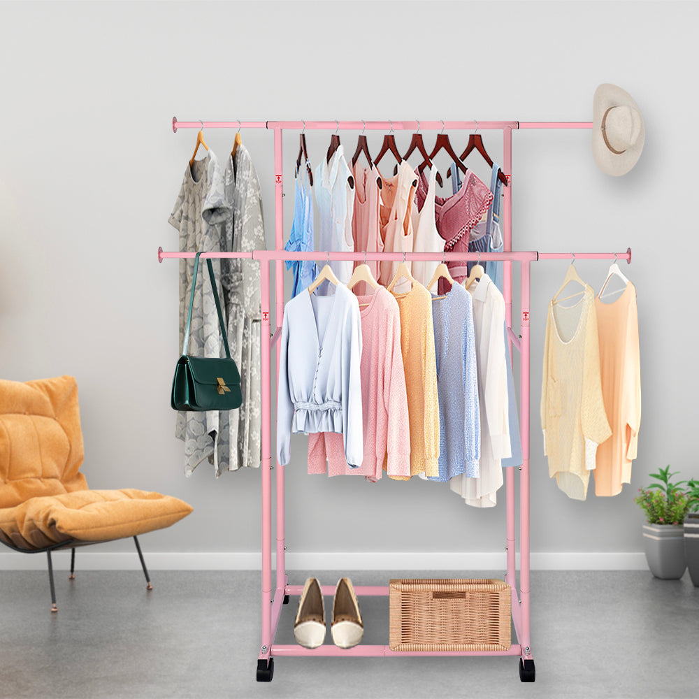 Pink Double Rod Garment Rack with Wheels, Heavy Duty Metal Clothes Rack Holds Up to 200 lbs, Adjustable Clothing Rack with Bottom Shelf and Side Hooks