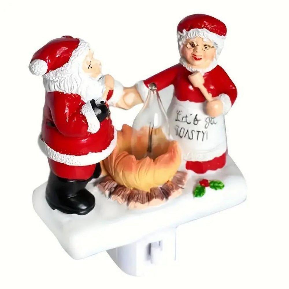 Christmas Plug-in Night Light Santa and Mrs Claus Roasting Marshmallow by Campfire Flickering Flame Resin Figurine Wall Sconce.